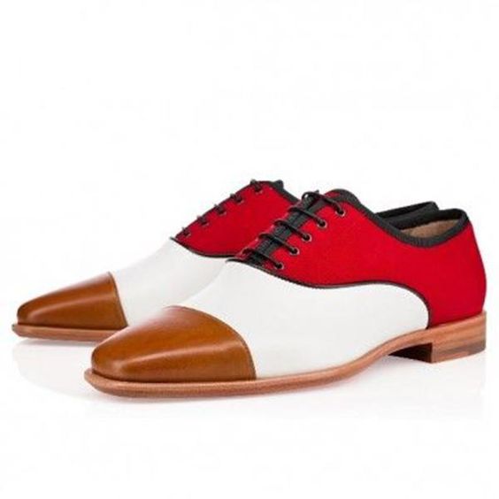 Red, white, and brown dress shoes on a white background